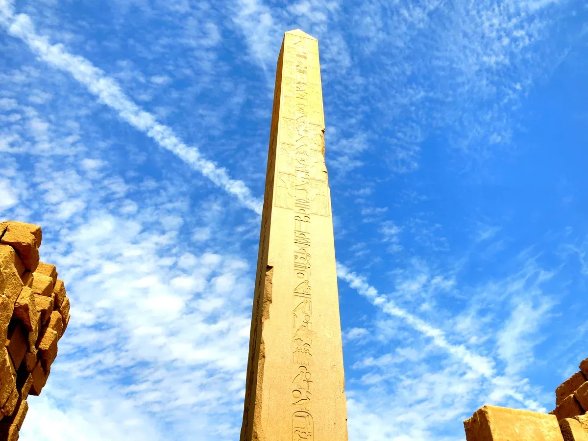 The obelisk of Hatshepsut rising above the ruins at Karnak, seen on a Valley of the Kings tour